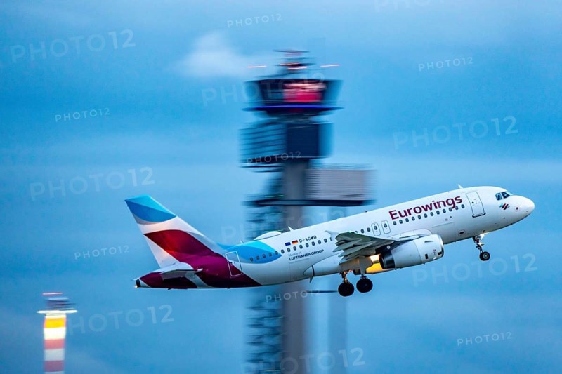 Eurowings Airbus A319 taking off from Düsseldorf Airport, Air Traffic Control Tower, North Rhine-Westphalia, Germany