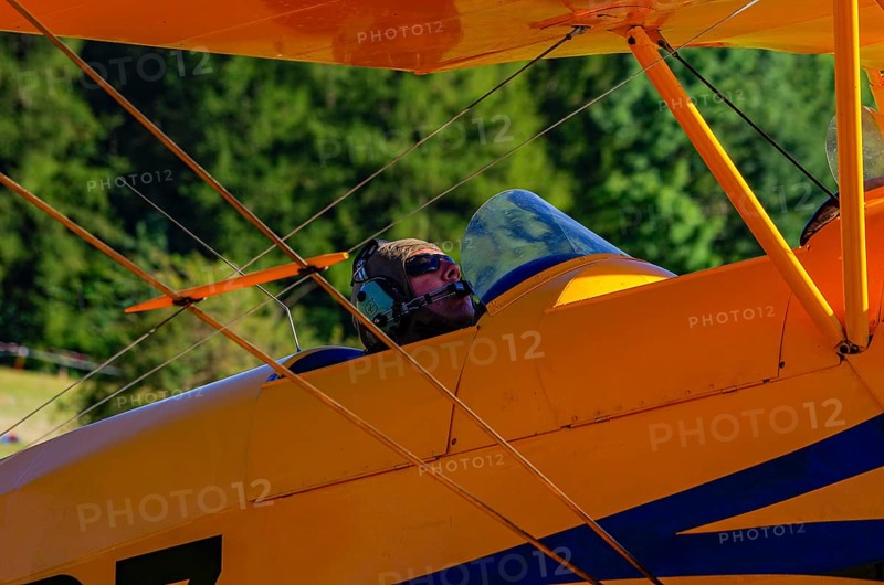 A biplane Bücker Bü 131 Jungmann with registration SP-YPZ during a flight demonstration as part of an air show on Rossfeld in Metzingen-Glems, Baden-Württemberg, Germany, for editorial use only