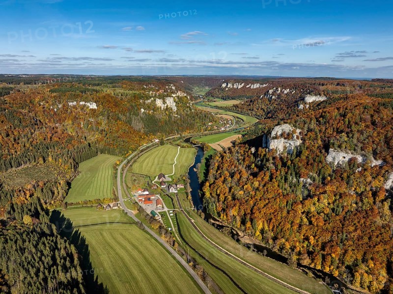Aerial view of Upper Danube Valley surrounded by autumn vegetation, on the horizon Werenwag Castle, Sigmaringen district, Baden-Württemberg, Germany
