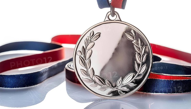 A gold medal with a wreath on it is hanging on a red, white, and blue ribbon, AI generated