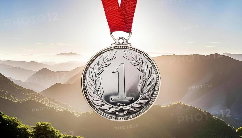 A silver medal with a red ribbon and the number 1 on it. The medal is surrounded by mountains and the sky, AI generated