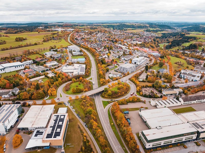 City panorama with street and buildings in autumn colors seen from a bird's eye view, Dornstetten, Freudenstadt district, Germany