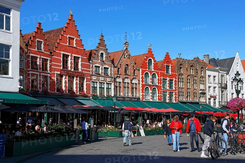 Historic houses on the market square in the old town of Bruges, Grote Markt, former guild houses, now restaurants and cafes, UNESCO World Heritage Site, Flanders, Belgium