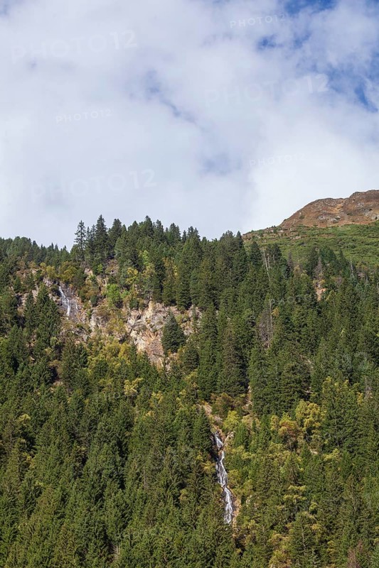 Waterfall with forest and mountains on Wilde Wasser Weg in autumn, WildeWasserweg, Stubai Valley, Tyrol, Austria