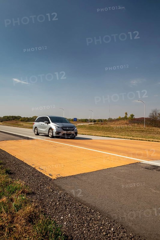 Blue Earth, Minnesota - A 'Golden Stripe' of yellow pavement marks the spot where Interstate 90 was completed in 1978. Stretching 3, 099 miles from Boston to Seattle, I-90 is the longest U.S. Interstate highway. 'Golden Stripe' recalls the 1869 'Golden Spike' of the first transcontinental railroad