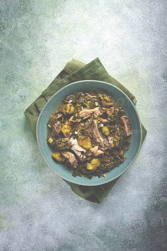 Chakapuli, Georgian dish, stewed meat with herbs and tkemali, in white wine, homemade, no people