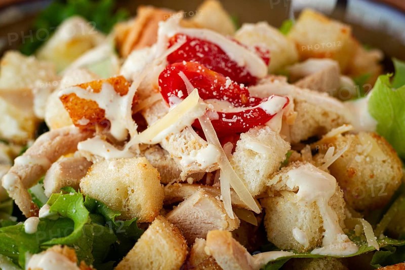 Classic Caesar salad, close-up, natural light, selective focus, horizontal
