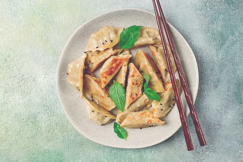 Japanese fried dumplings, gyoza, sesame seeds, top view, no people