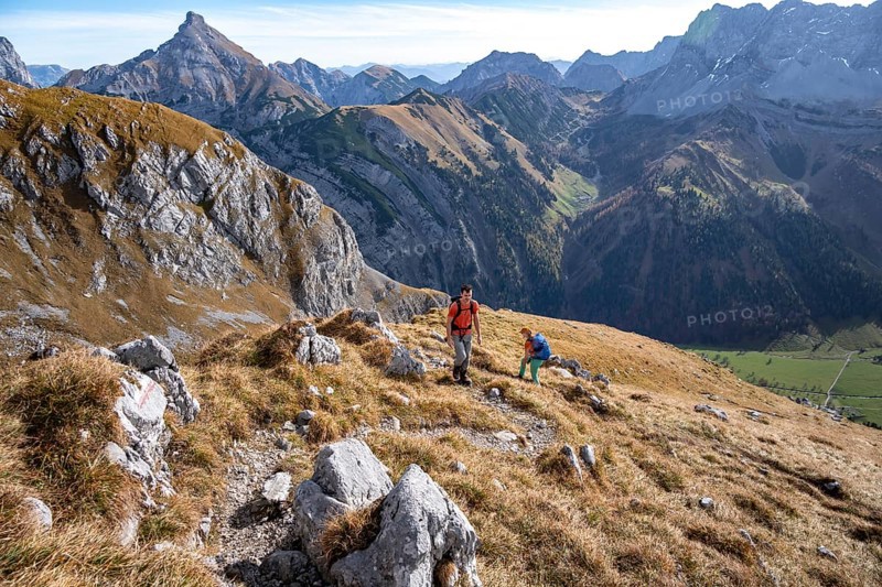 Two hikers on hiking trail, hiking to Gamsjoch, down the Ahornboden valley, eastern Karwendel, Tyrol, Austria