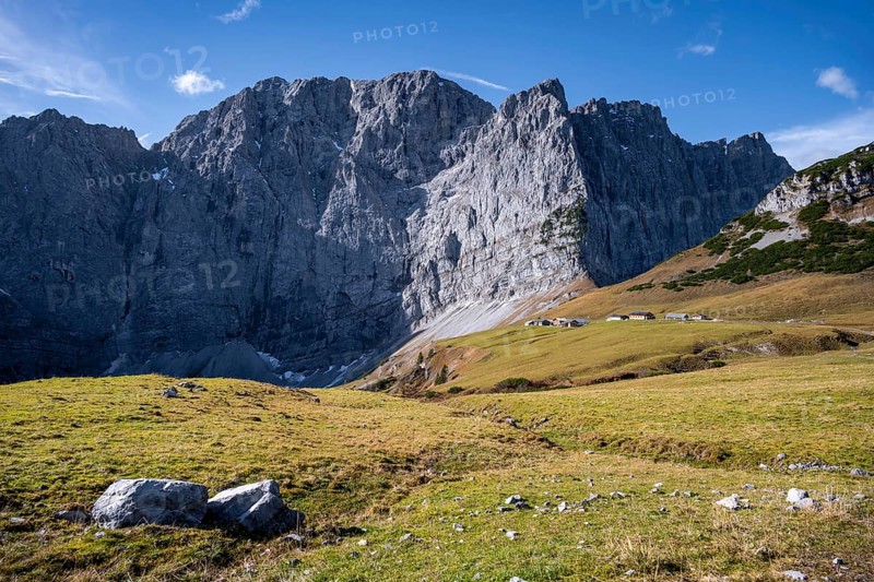 Dreizinkenspitze and Laliederer Wand, large rock face with meadows in the foreground under blue sky, eastern Karwendel, Tyrol, Austria