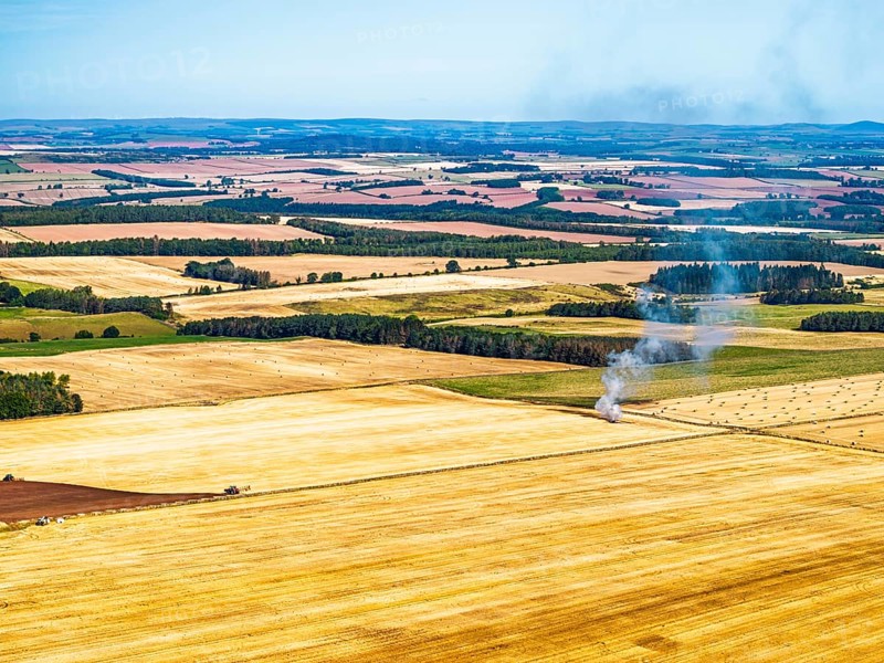 Scottish fields over Waterloo Monument from a drone, Jedburgh, Scotland, UK