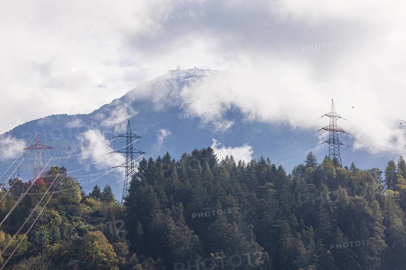Patscherkofel mountain with power poles in autumn, Innsbruck, Tyrol, Austria