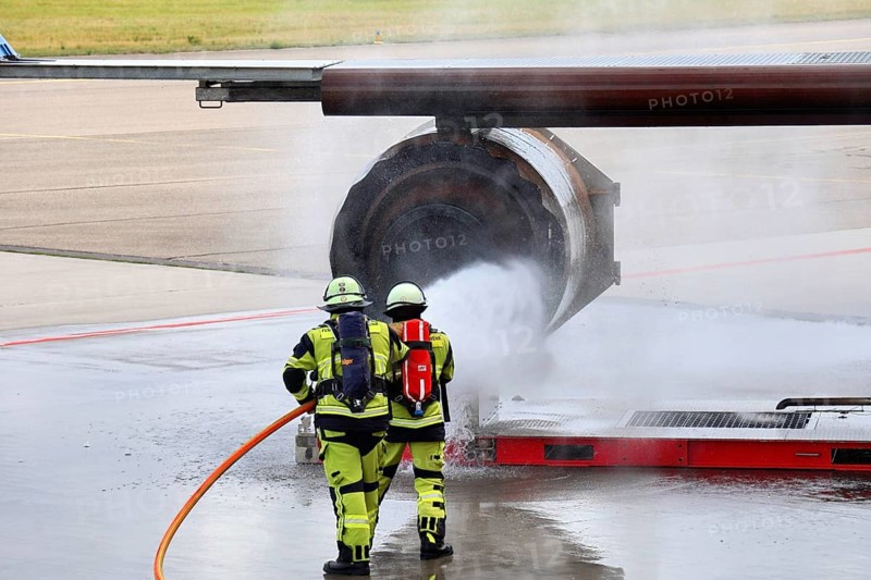 Stuttgart Airport Fire Department is practicing emergencies on a state-of-the-art simulator. Emergency service extinguish fire