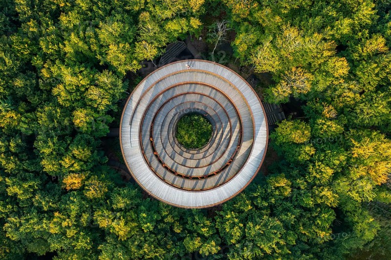 Aerial view over 45-meter-tall hyperboloid observation tower in forest near Gisselfeld monastery at Haslev on Zealand island in late summer, Denmark