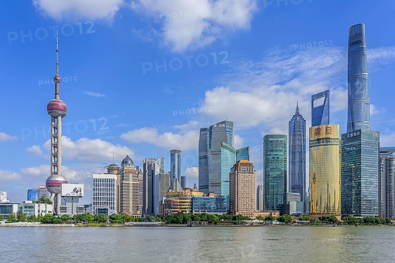 Huangpu River and Lujiazui skyline with skyscrapers, Shanghai Tower and Oriental Pearl Tower in financial district of Pudong at city Shanghai, China