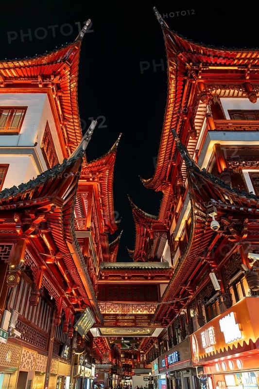 Yuyuan Tourist Mart, formerly Yuyuan Shopping Mall in the Old Street illuminated at night in the Huangpu District in the city Shanghai, China