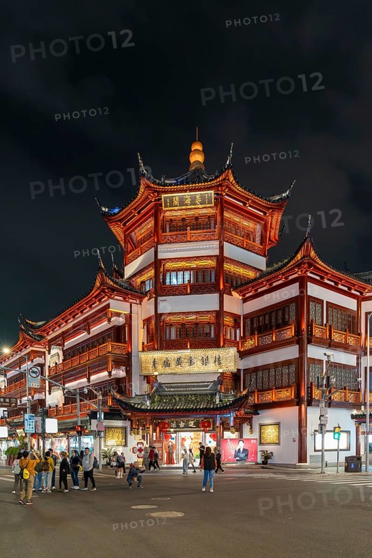 Yuyuan Tourist Mart, formerly Yuyuan Shopping Mall in the Old Street illuminated at night in the Huangpu District in the city Shanghai, China