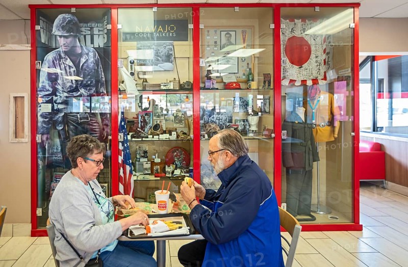 Kayenta, Arizona - A Navajo Code Talker display inside a Burger King restaurant on the Navajo Nation. The U.S. military used Navajo men to transmit messages in their language during World War II. The restaurant is owned by the son of an original Code Talker