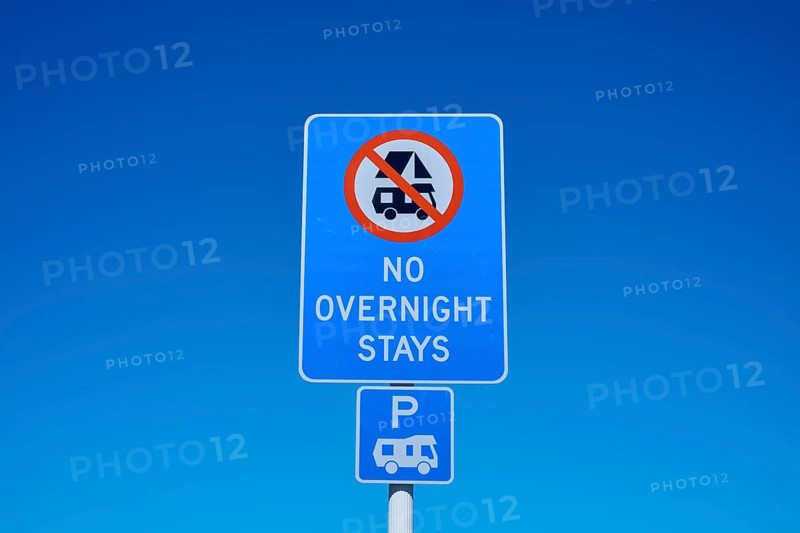 Road sign banning camping under clear blue sky, Lake Pukaki Viewpoint, Pukaki, Canterbury, South Island, New Zealand