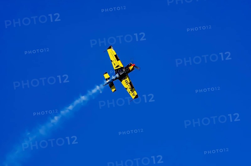 A Votec 351 sport aircraft from the Swiss MSW Aviation AG with registration HB-YMV during a flight demonstration as part of an air show on Rossfeld in Metzingen-Glems, Baden-Württemberg, Germany, for editorial use only