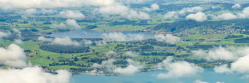 Panorama from Tegelberg, 1881m, of Hopfensee, in front of Lake Forggensee, Ostallgäu, Bavaria, Germany