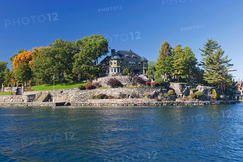 House on a small island in the Saint Lawrence River, 1000 Islands Park, on the borderline the Province of Ontario Canada and the US-American side