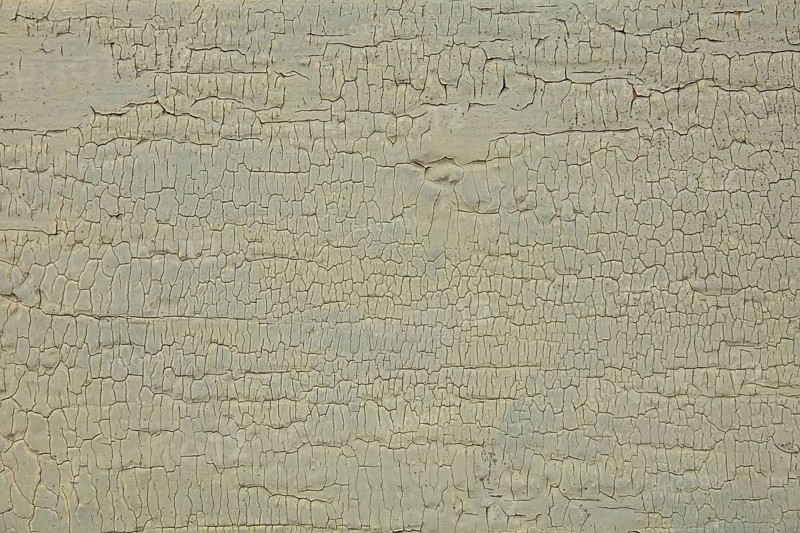 Abstract closeup surface view of old paint cracked on a wall, Suomusjärvi kirkonkylä, Finland
