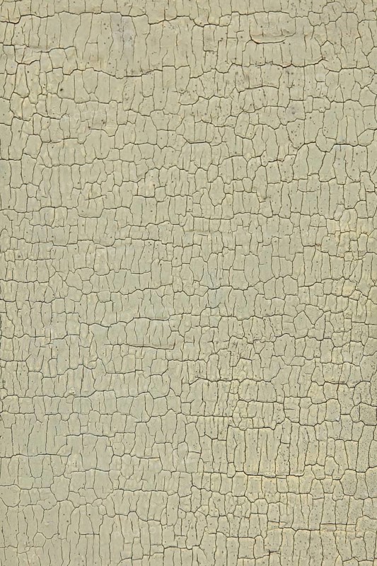 Abstract closeup surface view of old paint cracked on a wall, Suomusjärvi kirkonkylä, Finland
