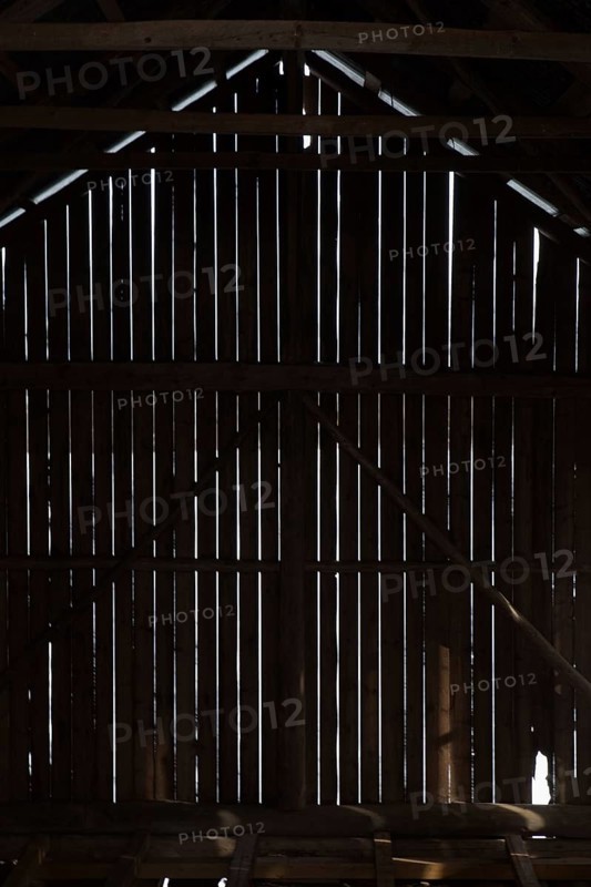 Silhouette of barn wall boards from inside, Junkarsborg, Finland