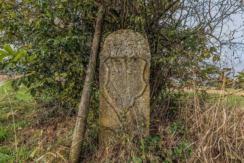 Border stone from 1737 on the cantonal border between Aargau and Lucerne, formerly the canton of Bern. Menziken, Aargau, Switzerland