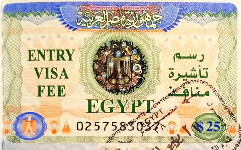 Tourist visa with stamp for entry to mainland Egypt, pasted into the passport at the airport of Ophira (Ras Nasrani) .This visa helps travelers from all over the world to migrate freely and move from the Sinai Peninsula (Western Asia) to the African part of the country without restrictions. South Sinai. Sharm el-Sheikh, Egypt