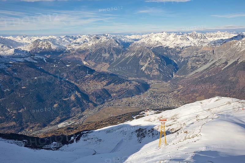 The town of Bormio is nestled in the Ortler-Cevedale mountain range in Italy. The landscape is characterized by high and snow-capped mountains