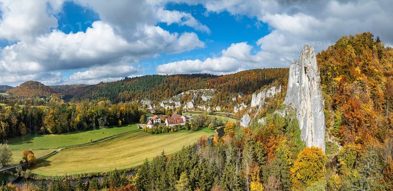 Aerial view, panorama of Käppeler estate with the St. George's Basilica near Thiergarten in the upper Danube Valley, surrounded by autumn vegetation, on the right the raven rocks, climbing rocks, Jura limestone rocks, Sigmaringen district, Baden-Württemberg, Germany