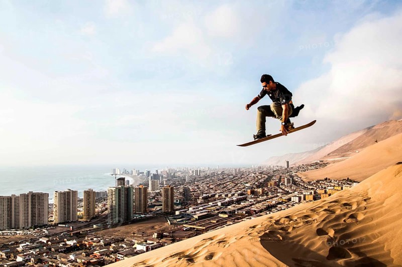 Sandboarding in Cerro Dragon, in Atacama Desert. Iquique, Tarapaca Region, Chile. 19.11.15