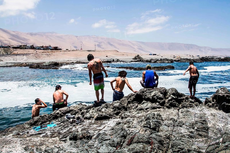 Group of people at Los Verdes Beach (Playa los Verdes). Iquique, Tarapaca Region, Chile. 19.11.15