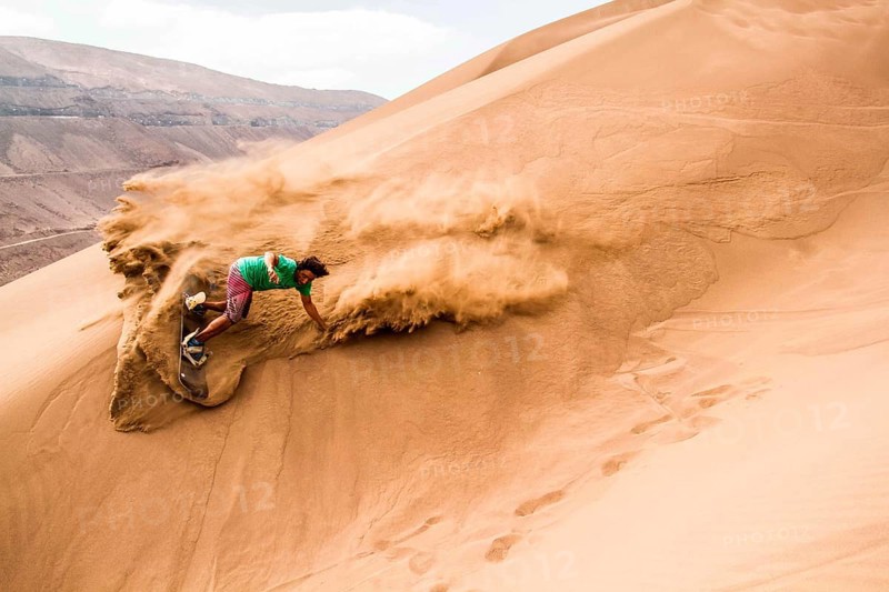 Sandboarding in Cerro Dragon, in Atacama Desert. Iquique, Tarapaca Region, Chile. 18.11.15