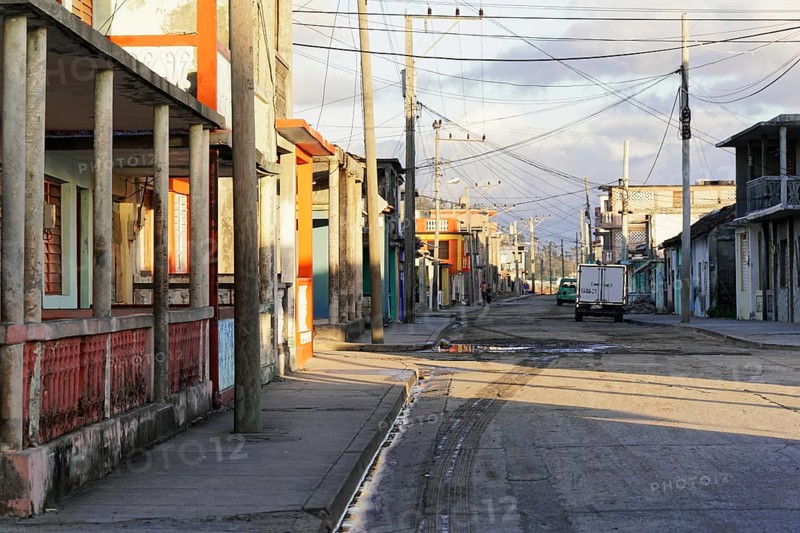 Baracoa, Cuba, Central America, Deserted street with empty sidewalks and visible old buildings, Greater Antilles, Caribbean, America, Central America