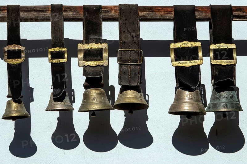 Cowbells hanging on a house wall, Schwand, Stillachtal, near Oberstdorf, Oberallgäu, Allgäu, Bavaria, Germany