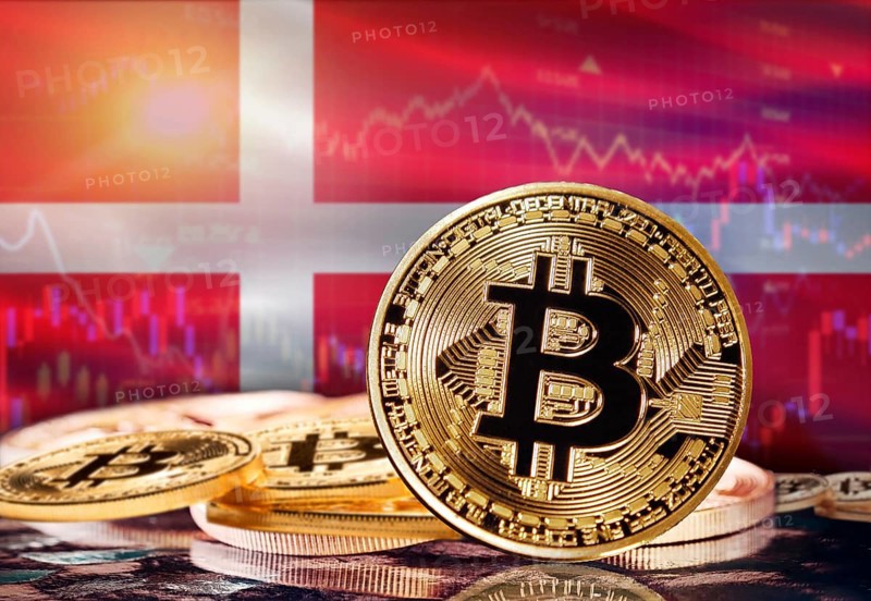 Bitcoin with Denmark flag in the background. Investors in cryptocurrency and Blockchain Technology in Denmark, Concept