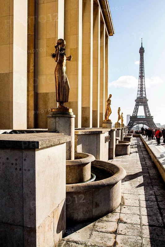 Gilded bronze statues at Palais de Chaillot and Eiffel Tower (Tour Eiffel) in the background. Paris, France. 30.12.12