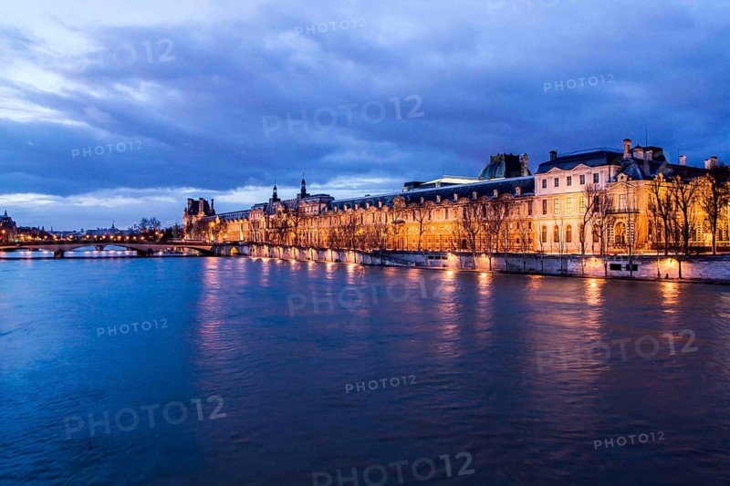 Seine River and Louvre Palace (Palais du Louvre) viewed from Pont des Arts at evening. Paris, France. 30.12.12