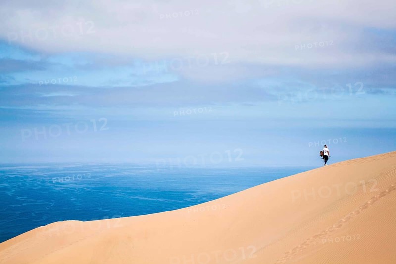 Sandboarder in Alto los Verdes, in Atacama Desert. Iquique, Tarapaca Region, Chile. 19.11.15