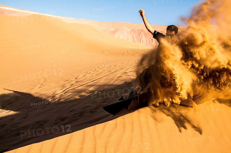 Sandboarding in Cerro Dragon, in Atacama Desert. Iquique, Tarapaca Region, Chile. 17.11.15