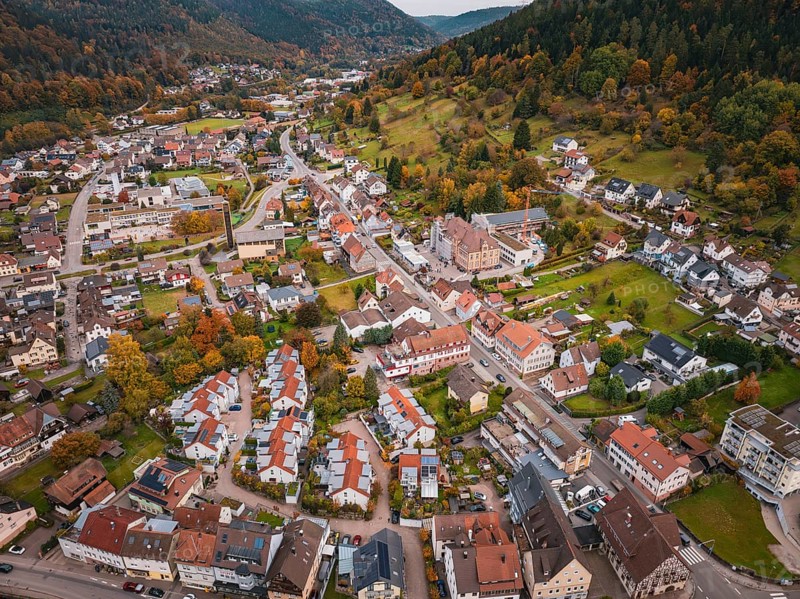 Panorama of a village view surrounded by hills in autumn colors and natural surroundings, Calmbach, Bad Wildbad, Black Forest, Germany