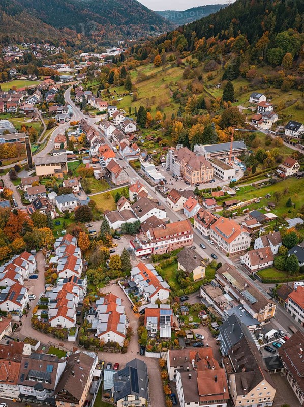Aerial view of an urban area with colorful autumn leaves and surrounding nature, Calmbach, Bad Wildbad, Black Forest, Germany