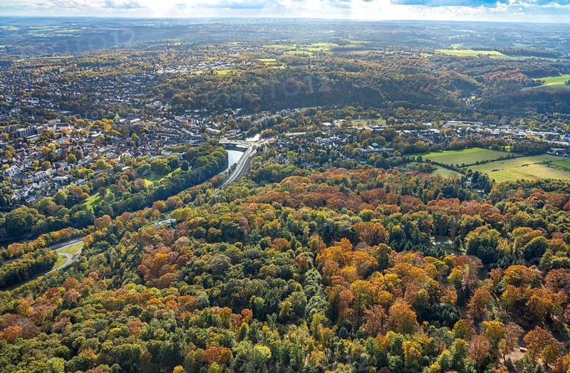Aerial view, river Ruhr and district of Werden with Gustav Heinemann bridge, Bredeneyer Straße B224 and railway tracks, below Villa Vue restaurant in autumn forest, view of the district of Heidhausen, trees in autumn colors, Bredeney, Essen, Ruhr area, North Rhine-Westphalia, Germany, colorful trees, DE, Essen-South, Europe, autumn, autumn colors, autumn forest colors, corn mill, aerial view, aerial photography, aerial photography, mixed forest, Neukircher Mühle, overview, bird's eye view, forest in autumn colors, birds-eyes view, colorful autumn leaves, autumn forest, overview, round bay window