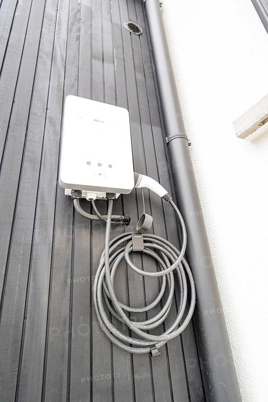 Charging station for electric cars on dark exterior, house renovation, climate renovation, Metzingen, Germany
