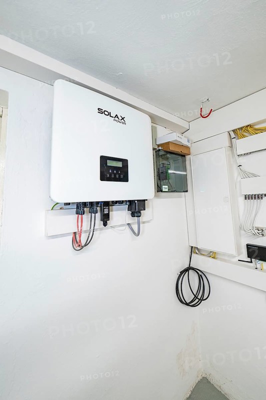 Wall-mounted SOLAX inverter in bright technical room, house renovation, climate renovation, Metzingen, Germany