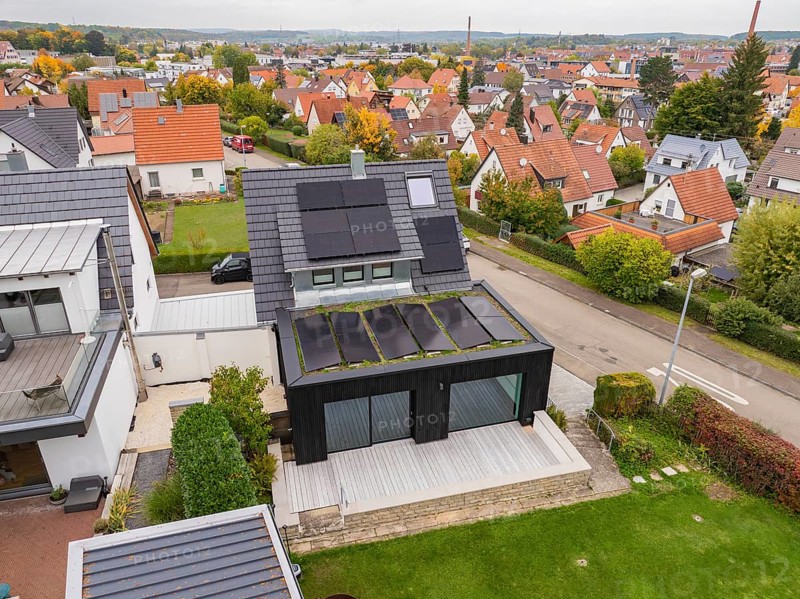 Aerial view of a house with solar system in a quiet residential area, house renovation, climate renovation, Metzingen, Germany