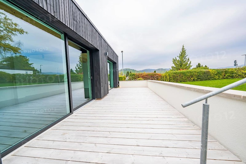Wide terrace with wooden flooring and views of the countryside under overcast sky, house renovation, air-conditioning renovation, Metzingen, Germany